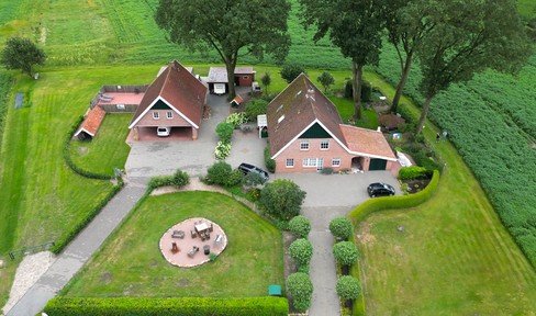 Picture book remaining farm for sale / space for 2 families / in border location - Netherlands